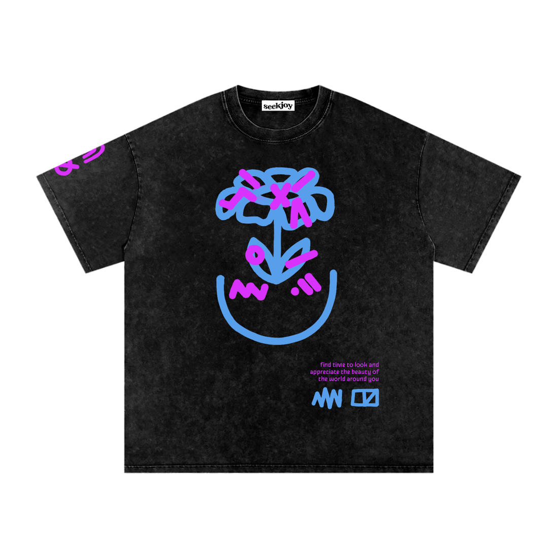 Perception tee laid flat in washed black, blue and pink scribbled flower above a smile