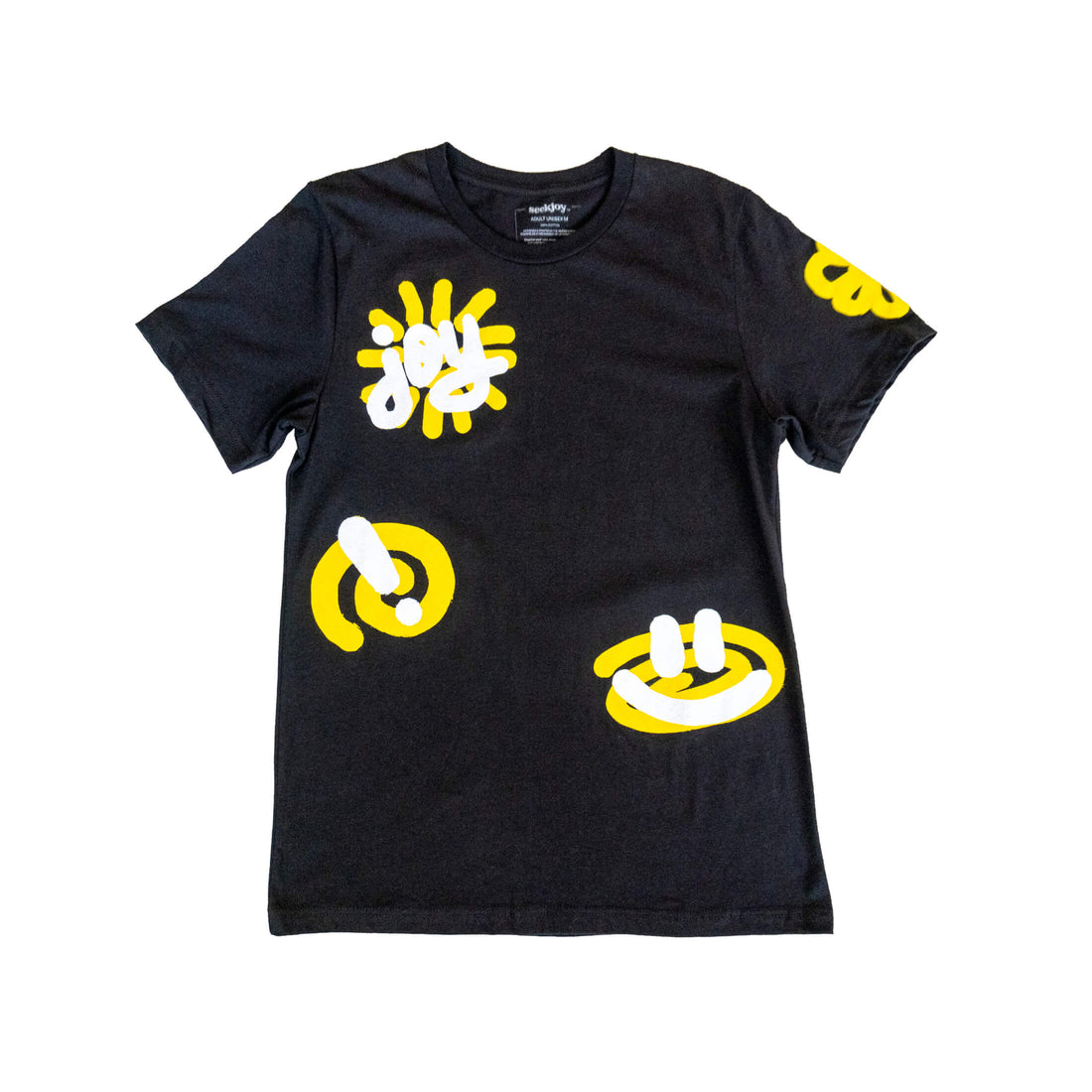 Burst of Joy tee laid flat, yellow and white scribbled flower and smiley graphics across the front and sleeves